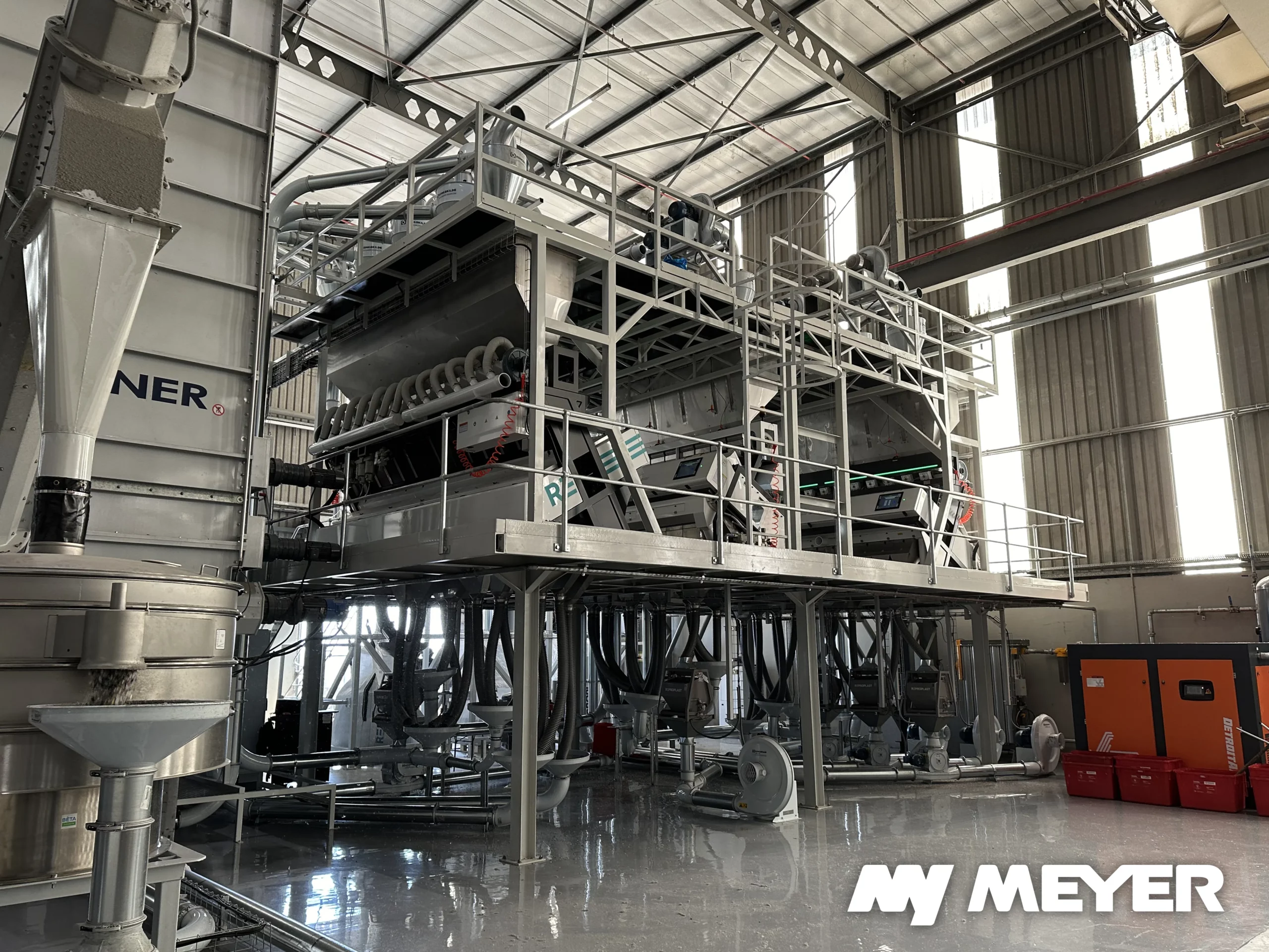 Complete Meyer optical sorting line with multiple sorters for polymer and color separation in a plastic recycling plant.