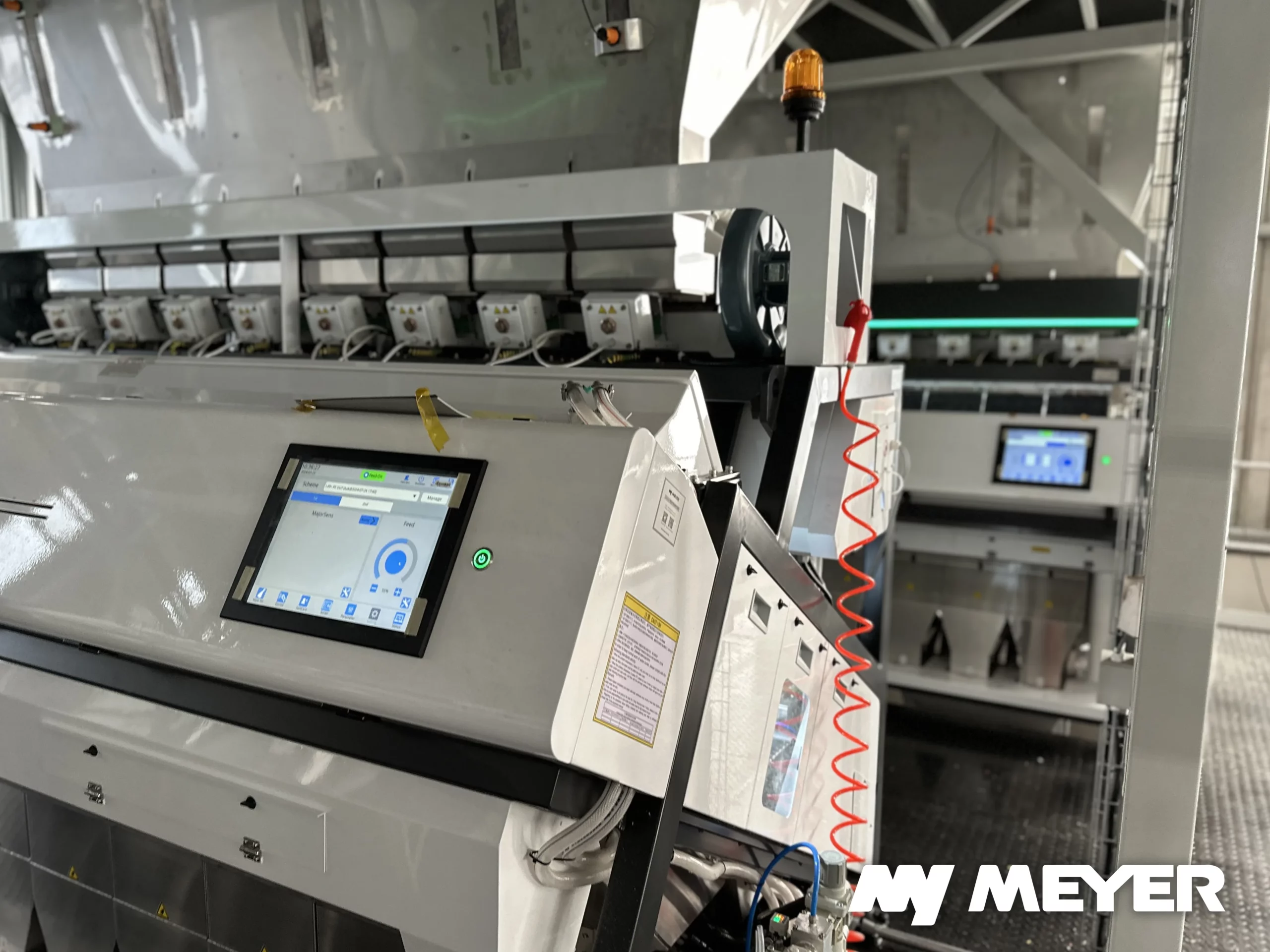 Multiple Meyer optical sorting machines installed in a recycling facility, each performing a dedicated role within the sorting process.