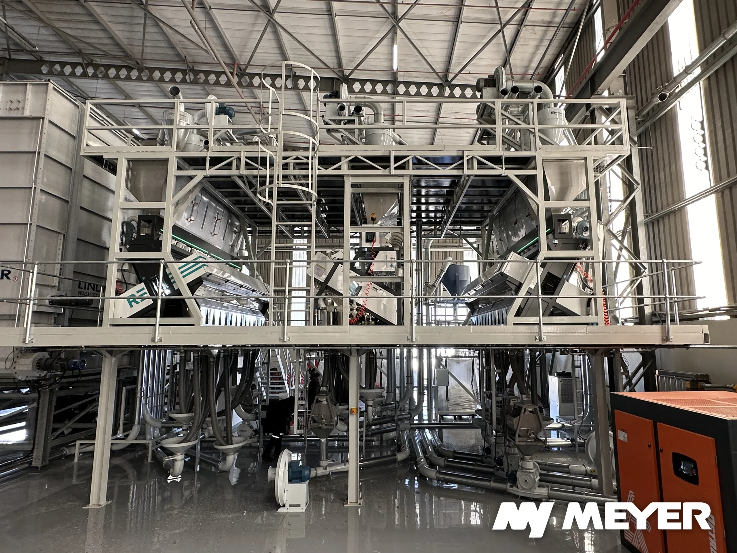 Complete Meyer optical sorting installation with multiple integrated sorters for polymer and color separation in a plastic recycling facility.